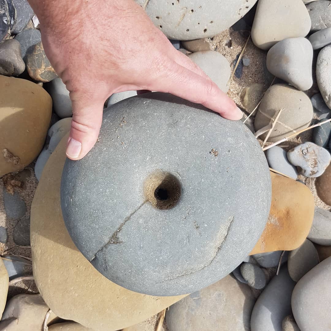 Any artifact experts out there? I found this stone today with a hole that seems to go all the way through. Could it be a stone anchor?

       